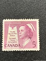 Full view of 1958 5-cent Nurse stamp showing portrait, slogan and denomination