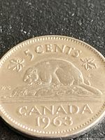 Reverse side showing “5 CENTS” beaver design and date 1963