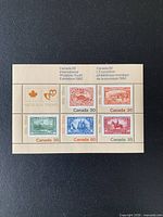 Front view of the souvenir sheet showing all five stamps and label