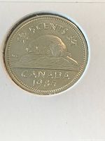 Reverse side of 1985 Canada five-cent coin showing beaver design, denomination and date