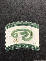 Front view of 47-cent Canada Year of the Snake stamp showing design and cancellation