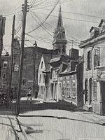 Close view of lithograph showing detailed streetscape and paper texture