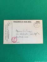 Front of WWII Canadian POW mail card with printed header, handwritten address, purple censor stamp 66 and black postmark