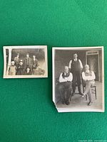 Both vintage photographs laid out showing subjects and damage to larger print