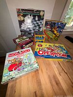 All seven boxed games displayed on tabletop