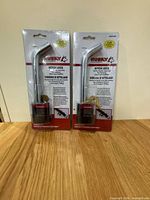 Two sealed Husky hitch lock packages on tabletop