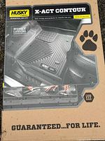Box front showing Husky Liners X-Act Contour branding and liner image