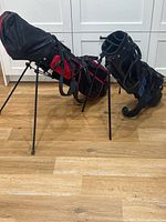 Two stand bags side by side on floor