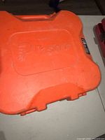 Closed orange Paslode hard carry case