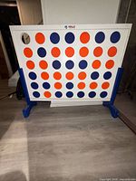 Front view of Rally Road giant wooden Connect Four with discs in place