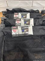 Three packaged StoutStuff Sport Ball Nets with visible labels