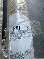 Manufacturer label showing product details: 9" inside corner flashing, white, made in Canada