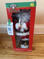Front view of boxed 16-inch animated Santa Claus figure showing window display and figure details