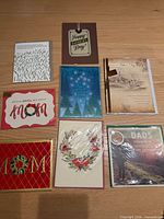 Fronts of eight greeting cards displayed