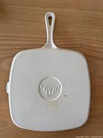 Underside showing white enamel and Cuisinart CB30-23 marking