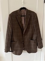 Front view of brown plaid Jack Victor blazer on hanger