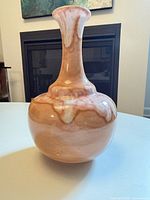 Front view of peach, pink and cream glazed vase