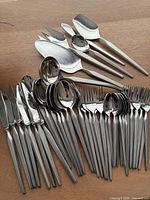 Overview of flatware and serving pieces laid out
