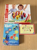 All three boxed games arranged on floor