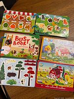 Two busy books and boxed 3D puzzle displayed