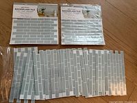 Two sealed packs, three loose full sheets, and multiple partial sheets displayed