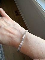 Bracelet worn on wrist showing full length of crystal line