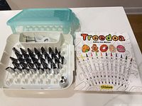 Set open showing piping tips in tray, couplers, storage case and marker box