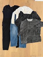 overview of five garments laid out on floor
