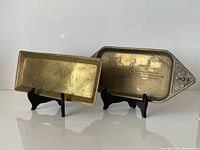 Both trays side by side on stands showing overall design and size relation