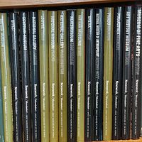 Spine view showing series title and individual museum names on fifteen matching books