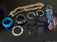 Assortment laid out showing all eight jewelry pieces