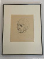 Front view of framed drawing showing mat and metal frame