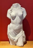 Front view of white classical torso sculpture