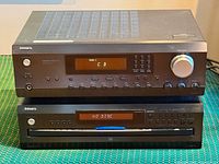 Front view of Integra stereo receiver stacked on Integra CDC-3.4 CD changer