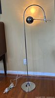 Full view of floor lamp with cord and base visible