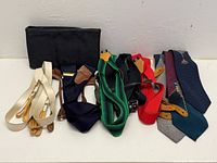Group shot of all ties, suspenders and pouch