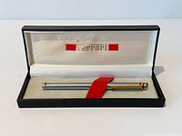 Ferrari pen resting in original presentation case with logo visible