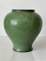 Front view of green speckled Isle of Wight Pottery vase
