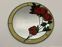 Front view showing entire stained glass mirror and rose design