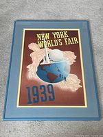 Full view of framed poster on floor
