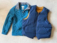 Front view of teal L.L.Bean jacket and navy vest showing overall style and condition