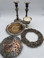 Group shot of all six metal decor pieces