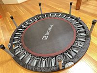 Overall view of folded BCAN rebounder showing frame, springs and legs