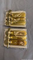 Two identical packaged barrel bolts side by side