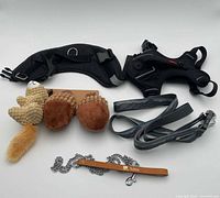 Overview of all items: harness, waist belt, plush toys, leash, chain lead