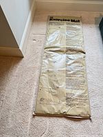Full view of vinyl exercise mat laid flat