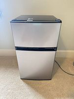 Front view of Frigidaire silver two-door mini fridge showing overall condition