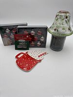 Group shot of all items: two ornament boxes, hooks package, Yankee Candle with shade, ceramic plate