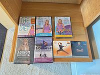 All seven sealed DVD cases laid out