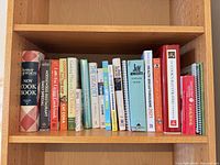 Shelf showing 19 cookbook spines
